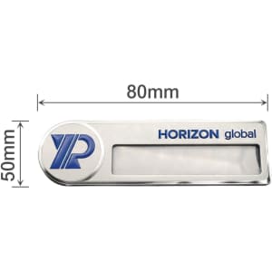 A custom reusable metal name badge featuring a silver finish with a blue logo and a clear window for a name.