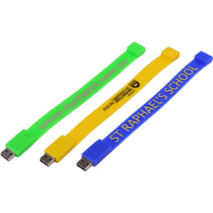 Three rectangular silicone wristband flash drives in bright green, yellow, and blue, each with a logo or branding.