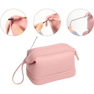 A large pink PU toiletry bag with a gold zipper and a wrist strap. It features multiple circular inserts showing zipper details.