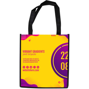 A tall non-woven tote bag in yellow with purple and pink abstract designs and a logo. Black handles are included.