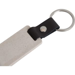 An eco-friendly mini flash drive keychain in beige with a black leather loop and a silver metal ring.