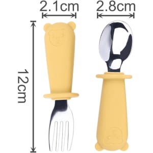 A yellow silicone cutlery set for kids, featuring a fork and spoon with bear-shaped handles. Includes a branding logo.
