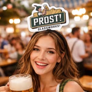 A woman wearing a black headband with a foam topper holding a glass of beer, smiling at the camera.