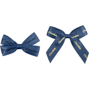 Two navy blue hair clips in bow shapes, one featuring the word "Forward" and the other with "Chocolate" printed on it.