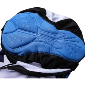 Close-up of blue padded interior of men's sublimated cycling bib tights with black outer fabric and a logo.