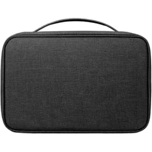 A portable travel toiletry bag in black, featuring a handle and a simple, sleek design. It has a logo on the front.