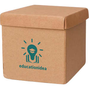 A brown cardboard cube with a lid and a logo on the front, designed for holding sticky notes.