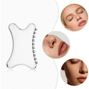 A clear Gua Sha tool with a curved shape and rounded edges, surrounded by close-up images of faces.