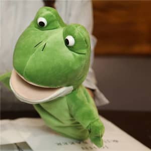A green frog hand puppet with big eyes and a wide mouth. It has a soft, plush texture and a simple design.