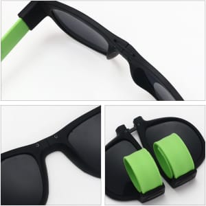 Slap band sunglasses with black frames and bright green bands for adjustable fit. Features a logo on the frame.