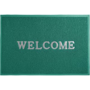A green debossed floor mat featuring a silver logo and the word "WELCOME" prominently displayed.