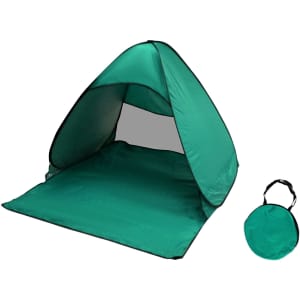 A green pop-up beach tent with a black trim, featuring a foldable design for easy storage.