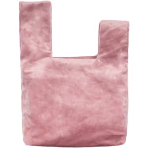 A pink velvet wrist bag featuring a unique knot design and an integrated handle. It has a logo on the surface.