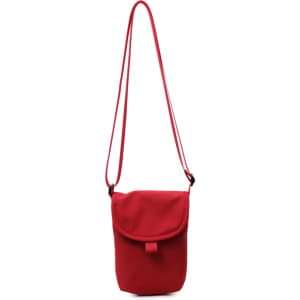 A small red canvas shoulder bag with a flap and adjustable strap. It has a simple, minimalist design.