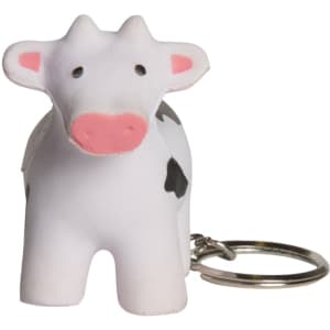 A white and black cow-shaped stress reliever keyring with a metal keychain attached.