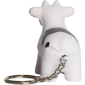 A keyring featuring a white and black cow stress reliever with a metal chain attached.