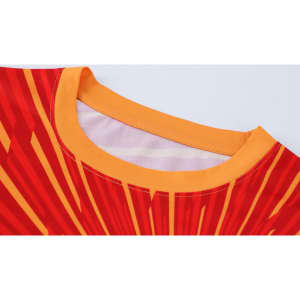A red and yellow long-sleeved shirt with a micro mesh design and a collar, featuring a logo.