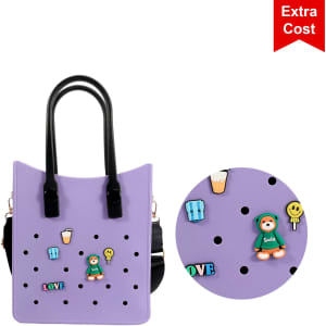 A purple tote bag with black handles, featuring playful embellishments and a logo.