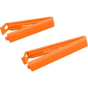 Two medium food bag seal clips in bright orange, designed to securely seal food bags.