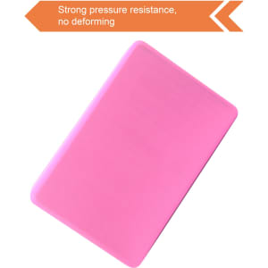 A pink EVA yoga block with a smooth surface. It features a logo and showcases strong pressure resistance.