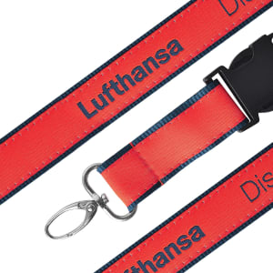 A detailed woven lanyard in red and black with a metal clip and a branded design.