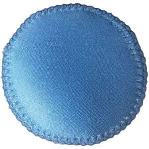 A drink bottle holder in light blue with a stitched edge, featuring a logo.