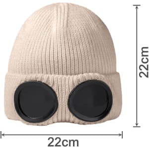 A beige beanie featuring large black goggles attached, measuring 22cm in height and diameter.
