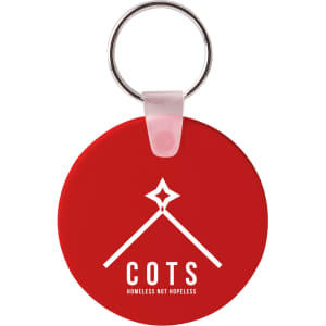 A round red Durasoft keyring with a silver metal ring, featuring a logo on one side.