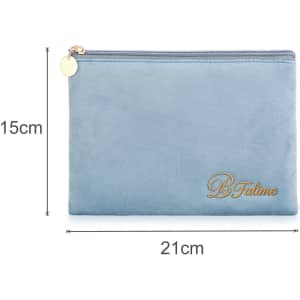 A flat makeup bag in light blue with a gold zipper and branding. Dimensions: 21cm x 15cm.