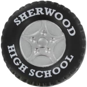 A black tire-shaped stress reliever featuring a silver wheel design and a logo.