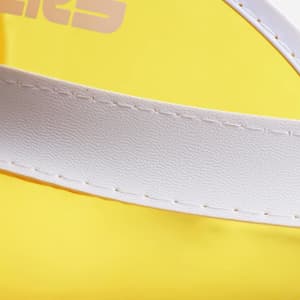 A close-up of a yellow PVC sunscreen hat featuring a white band and stitching. The hat also has a logo.