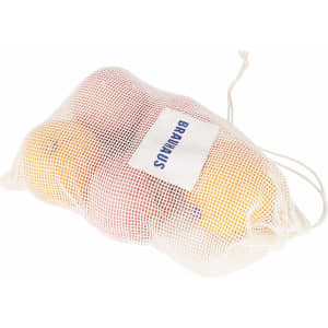 A white organic cotton mesh bag containing oranges and apples, secured with a drawstring closure.