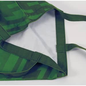 A green 220gsm sublimation canvas tote bag with a patterned exterior and plain interior, featuring sturdy handles.