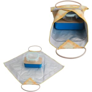 A yellow and silver lunch box bag, featuring a wooden lid and a circular handle, with an organised interior for food storage.