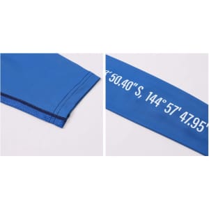A blue long-sleeved T-shirt made of polyester and spandex, featuring a logo and sunscreen protection.