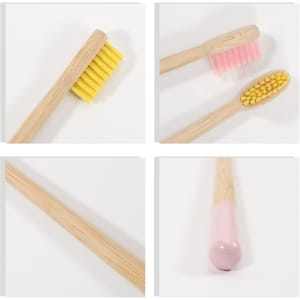 Four colourful toothbrushes with large conical handles. Yellow, pink, and a light pink brush head, featuring wooden handles.