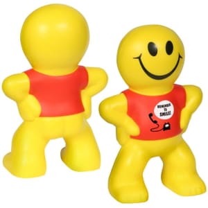 A yellow, smiling stress reliever shaped like a person, with a red shirt and a cheerful expression.