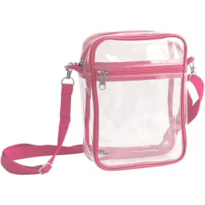 A clear tote bag with a zipper closure and pink trim, featuring an adjustable pink crossbody strap.