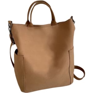 A tan vintage style canvas bag with two side pockets and both handles and a shoulder strap.