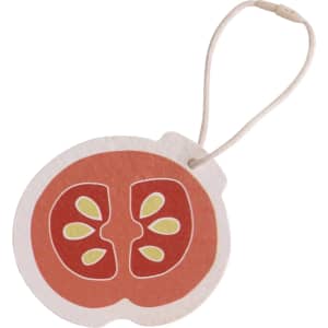 A round, red tomato-shaped promotional item with seeds, featuring a string loop for hanging.
