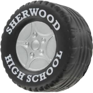 A black tire-shaped stress reliever with a silver wheel design, featuring a logo on the side.