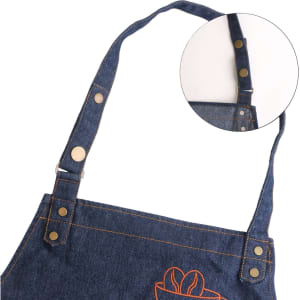 A denim full bib apron with a neck strap featuring a side view of the adjustable strap and a small inset of the clip.