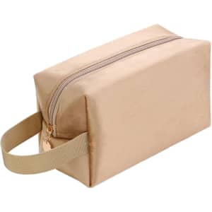 A flannel cosmetic bag in a soft beige colour with a zip closure and a handle on the side.