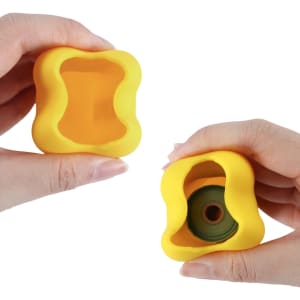 A yellow silicone dog poop bag dispenser shaped like a bone, being held in two hands.