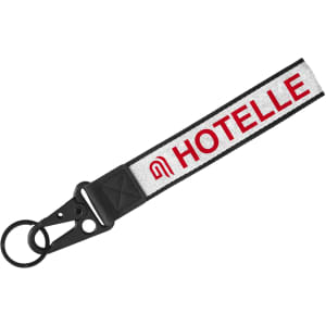 A Jacquard keyring featuring a black strap with a woven design and a circular keyring attachment.