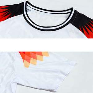 A breathable crew neck raglan tee shirt featuring red and black accents with a white body and a subtle graphic pattern.