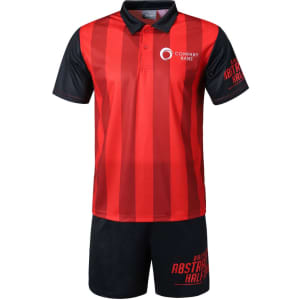A red and black sports uniform featuring a polo shirt and shorts, with a logo on the shirt and branding on the shorts.