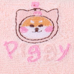 A soft pink towel featuring an embroidered cute piggy face and the word "piggy" in pink letters.