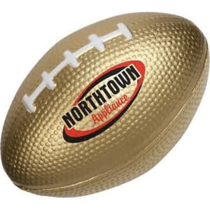 A gold rugby-shaped stress reliever with white laces and a logo. Ideal for fun and stress relief.