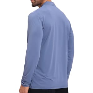A stylish light blue jacket with a stand-up collar and quarter-zip design, featuring long sleeves and a logo.